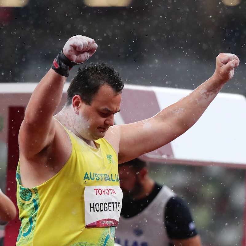 Todd Hodgetts celebrating as he competes in Men's Shotput for the 2020 Tokyo Paralympic Games. Green and gold Team Australia Para-athlete uniform.