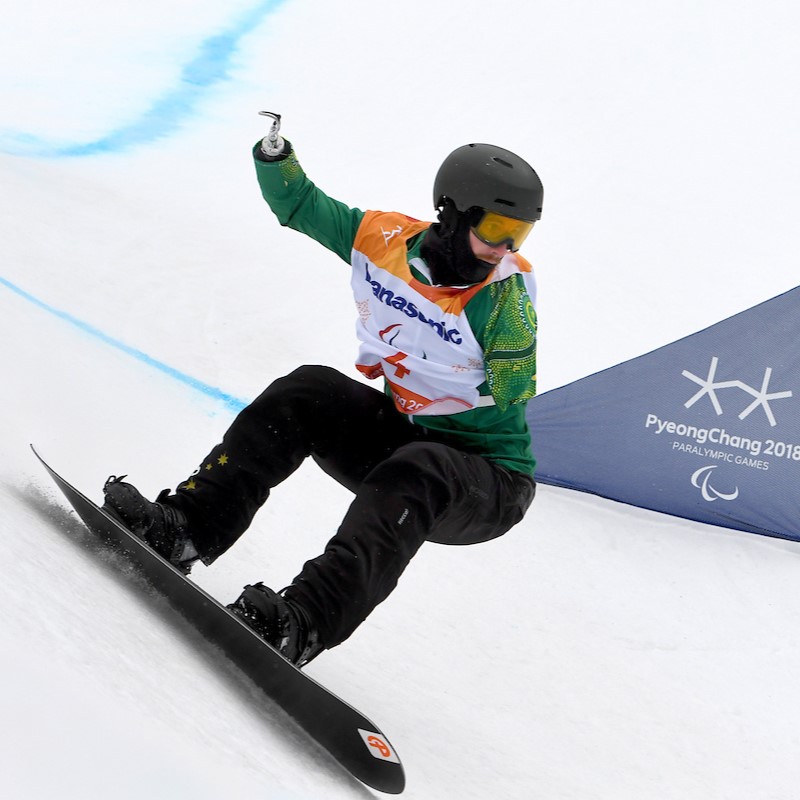 Male Paralympic Snowboarder competing