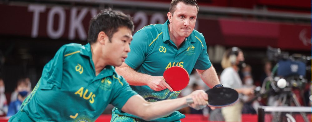 Two male Australian Para-table tennis players competing in a team event in Tokyo
