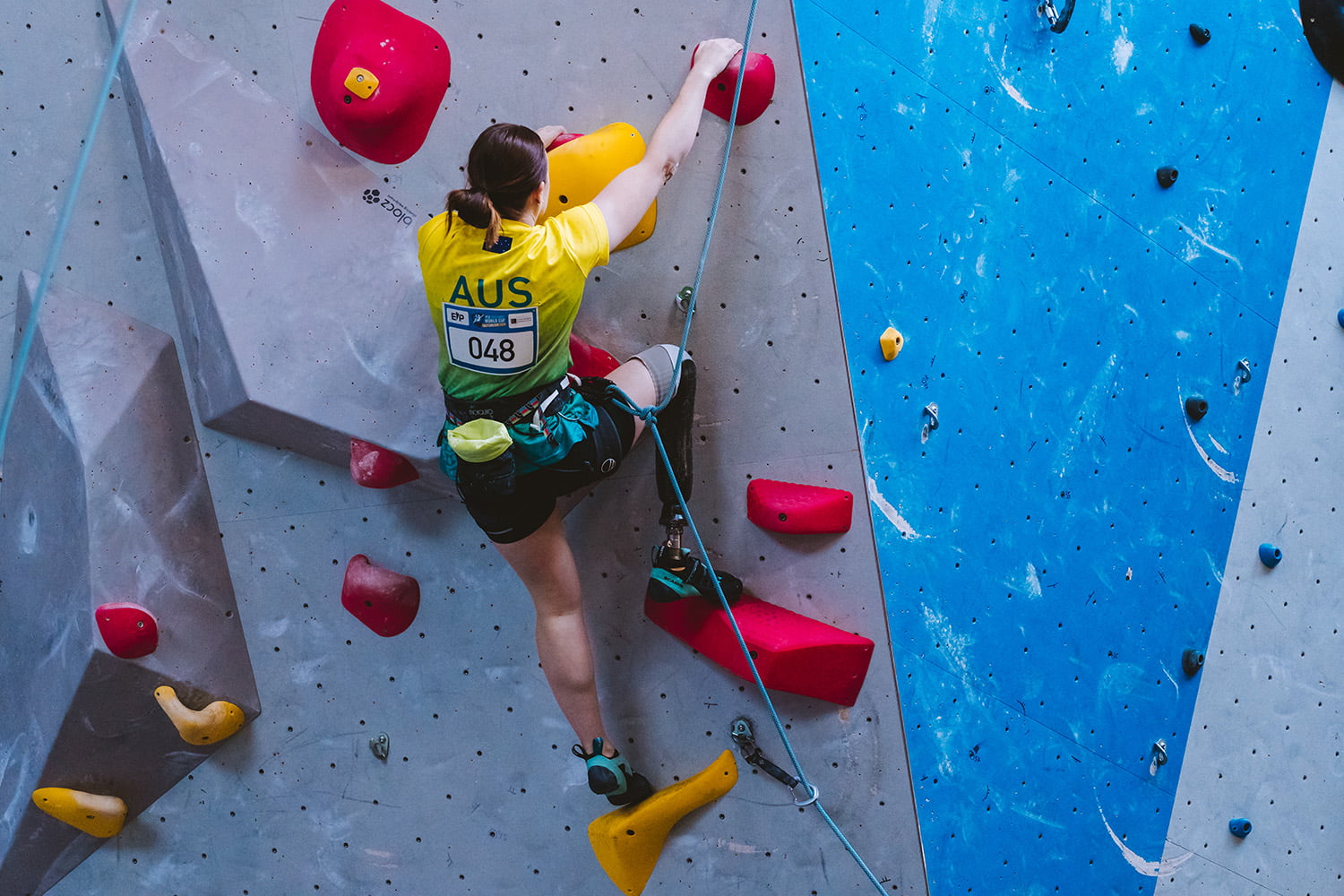 Para-athete on indoor climbing wall