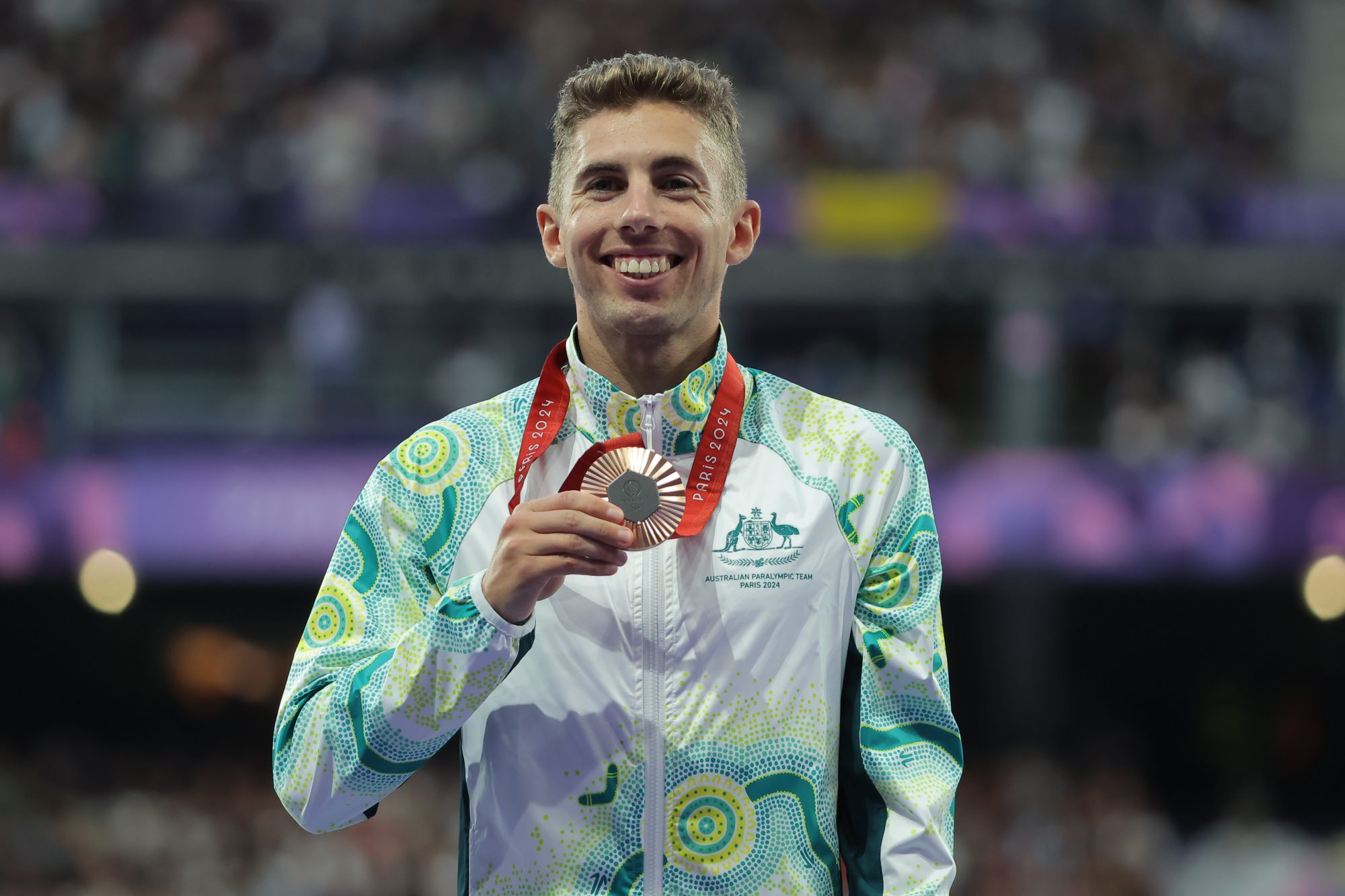 Reece Langdon celebrates winning bronze in the 1500m T38