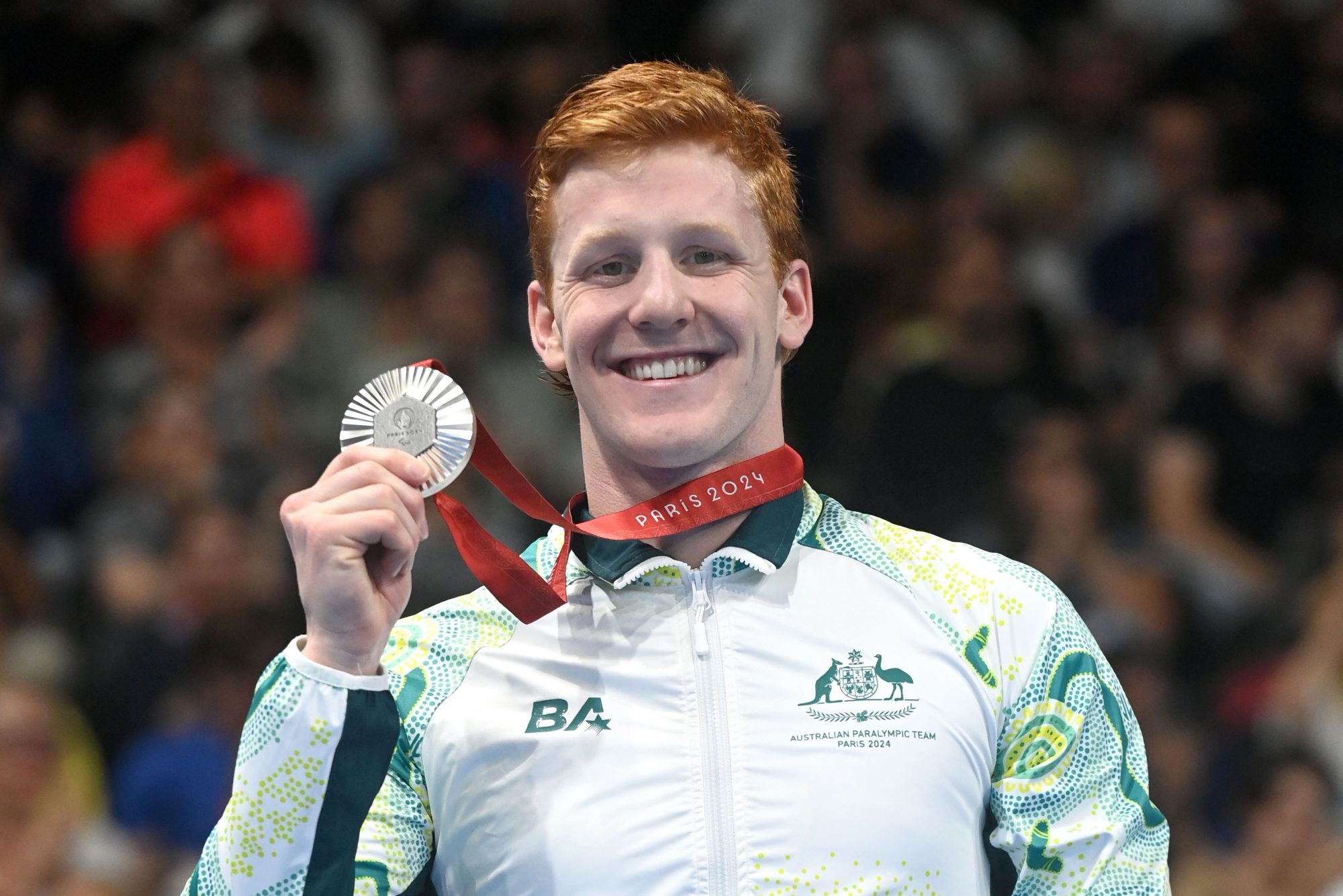 Col Pearse celebrates his silver medal in the men's 200m individual medley (SM10)