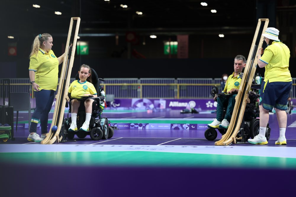 Boccia player Jamieson Leeson with ramp operator and trains alongside Dan Michel with ramp operator Ash Maddern.